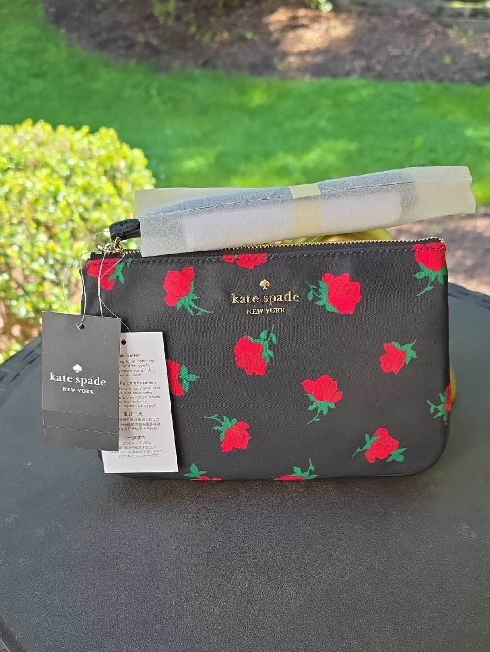 kate spade black clutch with red rose print